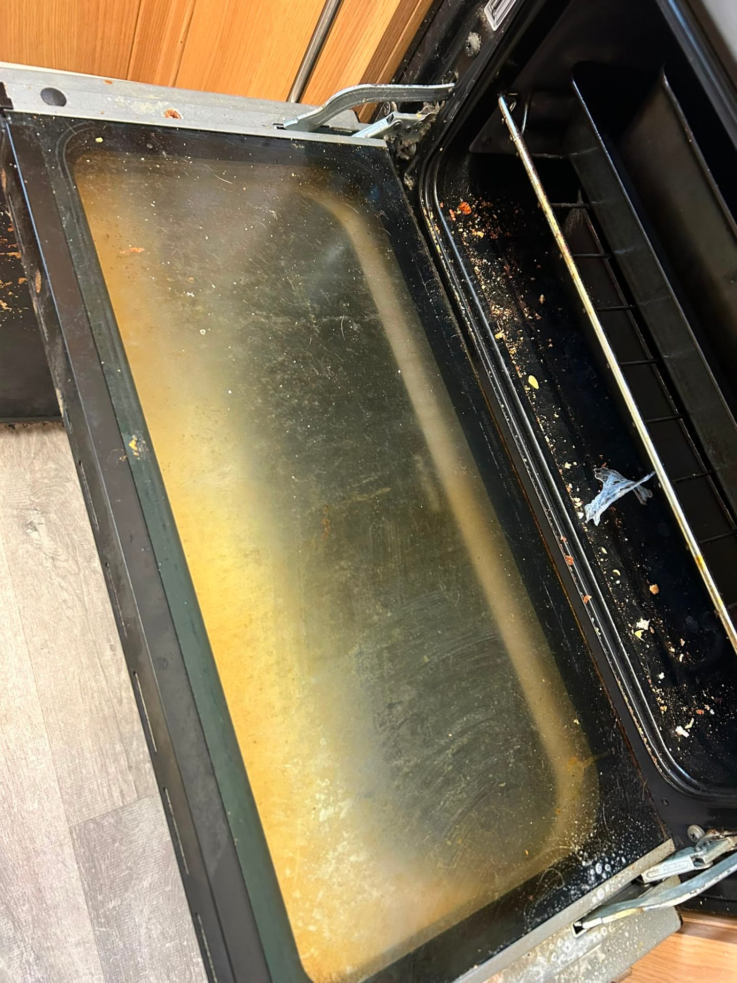 Before — Oven door — grease lifted